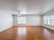 Bright and airy living room with hardwood flooring, modern ceiling fan and ample natural light at 1176 Liberty Hall Dr, Kissimmee, FL 34746