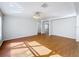 Bright and airy living room with wood-look floors and neutral walls at 1176 Liberty Hall Dr, Kissimmee, FL 34746