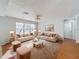 Cozy living room with plush sofas, accent tables, soft lighting and a decorative area rug at 1176 Liberty Hall Dr, Kissimmee, FL 34746