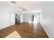 Open-concept living room with wood-look floors, ideal for entertaining and comfortable living at 1176 Liberty Hall Dr, Kissimmee, FL 34746