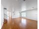 Expansive living room with hardwood flooring, neutral paint, and staircase leading to the second floor at 1176 Liberty Hall Dr, Kissimmee, FL 34746