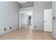 Bedroom features neutral paint, tile flooring, and closet with mirrored doors at 12213 Bohannon Blvd, Orlando, FL 32824