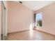 Bedroom featuring neutral paint, tile floors, and a window with a curtain at 12213 Bohannon Blvd, Orlando, FL 32824