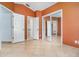 Bedroom featuring mirrored closet doors and neutral tiled floors at 12213 Bohannon Blvd, Orlando, FL 32824