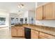 Open kitchen featuring granite countertops, tile flooring, and stainless steel appliances at 12213 Bohannon Blvd, Orlando, FL 32824