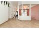 Spacious living room featuring tile floors, decorative columns, and lots of natural light at 12213 Bohannon Blvd, Orlando, FL 32824
