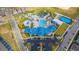 Aerial view of the community resort with a large pool, lazy river, and on-site parking at 136 Jetty Way, Davenport, FL 33897