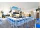Spacious outdoor bar area with ample seating and multiple televisions for entertainment at 136 Jetty Way, Davenport, FL 33897
