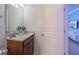 Bathroom with vanity and open door to a Frozen-themed bedroom at 136 Jetty Way, Davenport, FL 33897