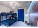 The bedroom features a bunk bed, Potter-themed pillows, and a castle-themed accent wall at 136 Jetty Way, Davenport, FL 33897