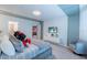 Comfortable bedroom with a soft bed, entertainment system, and easy access to other areas at 136 Jetty Way, Davenport, FL 33897