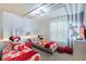 Themed bedroom with whimsical decor, comfortable twin beds, and unique lighting at 136 Jetty Way, Davenport, FL 33897