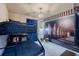 This bedroom features a bunk bed and Harry Potter-themed decor for an immersive experience at 136 Jetty Way, Davenport, FL 33897