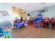 Fun game room featuring arcade games, air hockey, and a welcoming atmosphere at 136 Jetty Way, Davenport, FL 33897