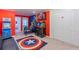 A fun game room with a table foosball table, and a Captain America rug at 136 Jetty Way, Davenport, FL 33897
