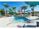 Relaxing community hot tub surrounded by lounge chairs, umbrellas, and tropical landscaping at 136 Jetty Way, Davenport, FL 33897