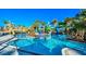 Beautiful resort-style lazy river with water slides and tropical landscaping at 136 Jetty Way, Davenport, FL 33897