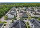 Overhead view of a residential community surrounded by lush greenery and mature trees at 1410 Resolute St, Celebration, FL 34747