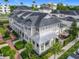 Aerial view of neighborhood featuring townhomes, lush greenery, and sidewalks at 1410 Resolute St, Celebration, FL 34747