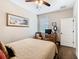 Charming bedroom with hardwood floors, comfortable bed, and natural light at 1410 Resolute St, Celebration, FL 34747