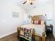 Cozy bedroom with hardwood floors, a wooden bed frame and a ceiling fan at 1410 Resolute St, Celebration, FL 34747