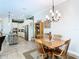 Cozy dining area open to kitchen featuring white cabinets and stainless appliances at 1410 Resolute St, Celebration, FL 34747