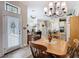 View from dining area to the open floor plan of the kitchen and living room at 1410 Resolute St, Celebration, FL 34747