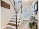 Inviting entryway with staircase featuring white risers and stained wood treads, leading to the upper level at 1410 Resolute St, Celebration, FL 34747