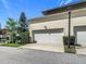 Exterior view of home featuring a two-car garage, manicured shrubs, and clean driveway at 1410 Resolute St, Celebration, FL 34747