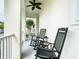 Cozy front porch featuring rocking chairs and ceiling fan at 1410 Resolute St, Celebration, FL 34747