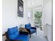 Relaxing porch with cozy seating, plants, and a welcoming sign at 1410 Resolute St, Celebration, FL 34747