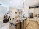 Kitchen featuring stainless steel appliances, island with seating, and a seamless flow to the living spaces at 1410 Resolute St, Celebration, FL 34747