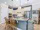 Spacious kitchen featuring granite countertops, stainless steel appliances, and a large island at 1410 Resolute St, Celebration, FL 34747