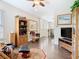 Comfortable living room featuring hardwood floors and display cabinets at 1410 Resolute St, Celebration, FL 34747