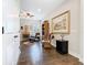 Comfortable living space featuring hardwood floors, ceiling fan, and a decorative painting at 1410 Resolute St, Celebration, FL 34747