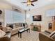 Comfortable living room with a neutral color scheme, plush seating, and a large window for natural light at 1410 Resolute St, Celebration, FL 34747