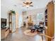 Spacious living area with hardwood floors, display cabinet, desk and comfortable furniture at 1410 Resolute St, Celebration, FL 34747