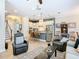 Open-concept living space with a kitchen featuring an island, leading to a comfortable and stylish living area at 1410 Resolute St, Celebration, FL 34747