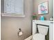 Charming powder room with flamingo art and a modern toilet design at 1410 Resolute St, Celebration, FL 34747
