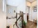 Stairway landing decorated with nautical themed items and a view into another room at 1410 Resolute St, Celebration, FL 34747