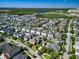 A residential neighborhood with neatly arranged homes, a lake, and green spaces in the distance at 14188 Walcott Ave, Orlando, FL 32827