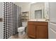 Bathroom featuring a checkered shower curtain, vanity, and a toilet at 14188 Walcott Ave, Orlando, FL 32827
