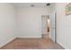 Empty bedroom with neutral carpet and a door leading to the bathroom at 14188 Walcott Ave, Orlando, FL 32827