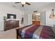 Bedroom featuring carpet, ceiling fan, and connected closet at 14188 Walcott Ave, Orlando, FL 32827