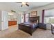 Bedroom with carpet, ceiling fan, and connected bath at 14188 Walcott Ave, Orlando, FL 32827
