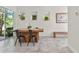 Modern dining space with tile flooring, large window and glass sliding door at 14188 Walcott Ave, Orlando, FL 32827
