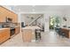 Open concept kitchen featuring an island, modern appliances and view of dining room at 14188 Walcott Ave, Orlando, FL 32827