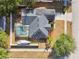Aerial view of a home with solar panels, screened pool and a boat in the backyard at 149 Southern Breeze Dr, Minneola, FL 34715