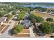 Beautiful aerial view of a home with a private pool and mature trees at 149 Southern Breeze Dr, Minneola, FL 34715