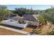 Features solar panels, a fenced yard, and a screened-in pool area at 149 Southern Breeze Dr, Minneola, FL 34715